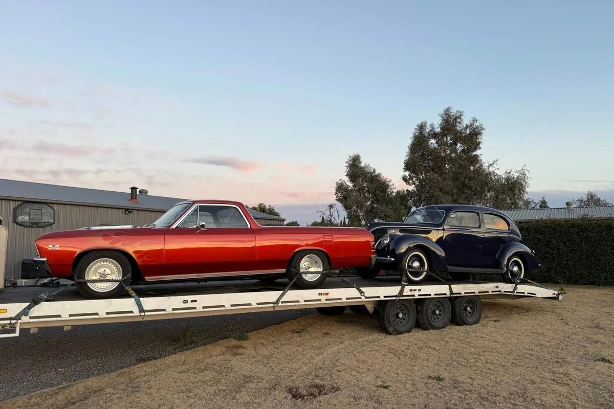 Vintage prestine cars being transported
